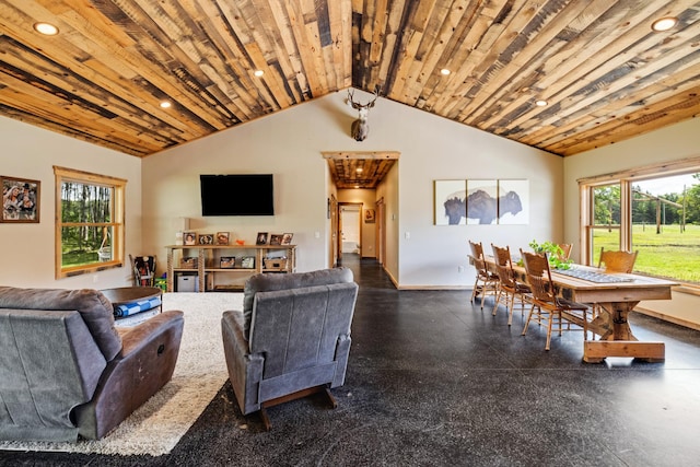 living area with plenty of natural light, recessed lighting, and vaulted ceiling