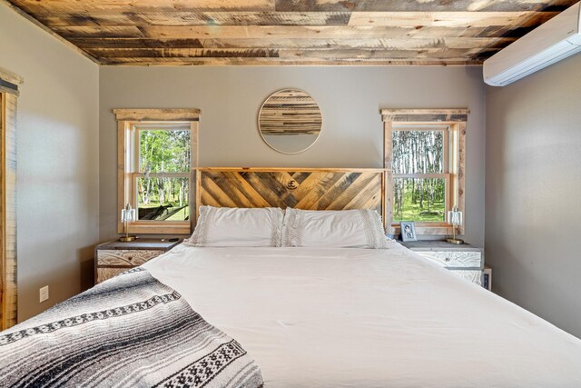 bedroom with wooden ceiling and a wall mounted air conditioner