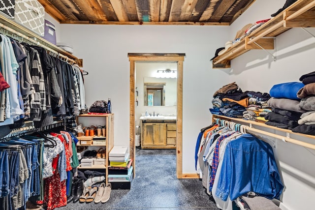 walk in closet featuring a sink