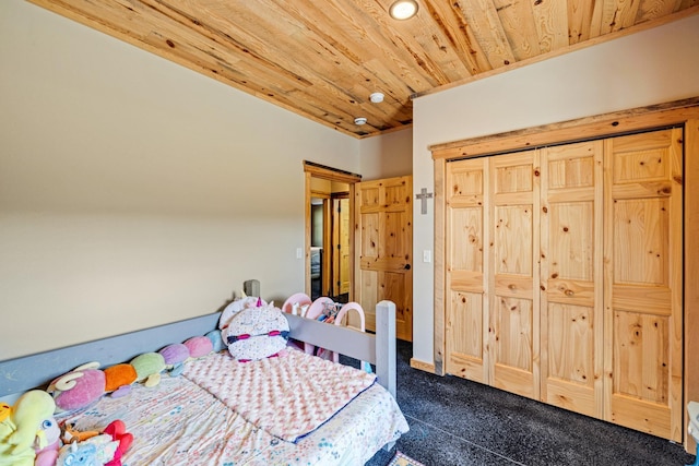 carpeted bedroom with wood ceiling