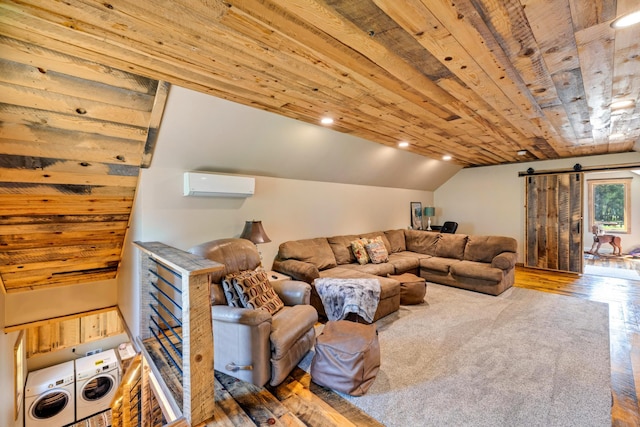 living room with hardwood / wood-style flooring, a barn door, lofted ceiling, a wall mounted air conditioner, and recessed lighting