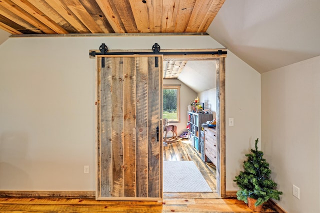 bonus room featuring vaulted ceiling and wood-type flooring