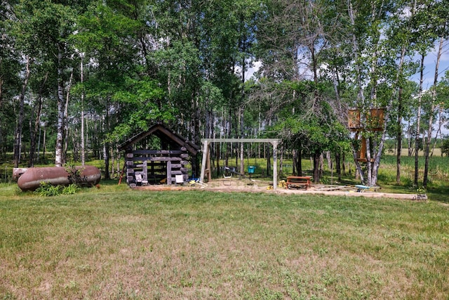 view of green lawn featuring a playground