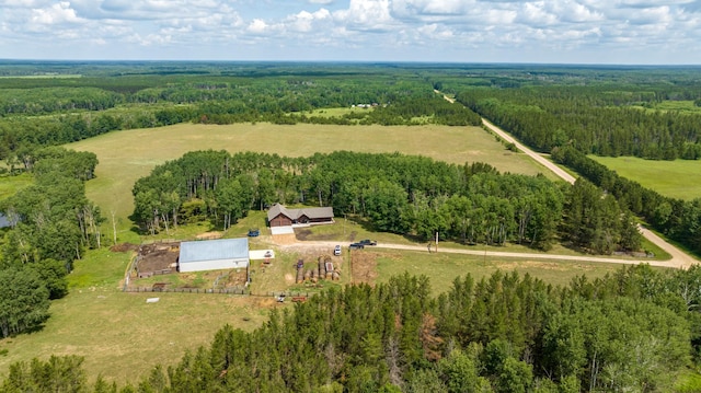 aerial overview of property's location featuring rural landscape and a heavily wooded area