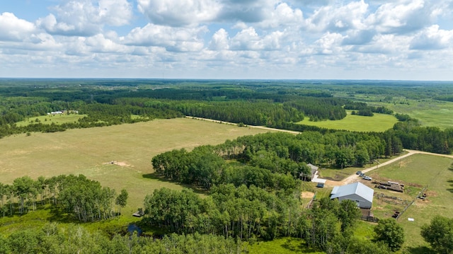 view of rural area featuring a heavily wooded area