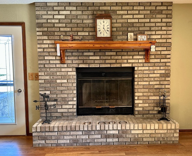 29441 108th St NW, Princeton, MN 55371 - detailed view of a brick fireplace, wood finished floors, and baseboards