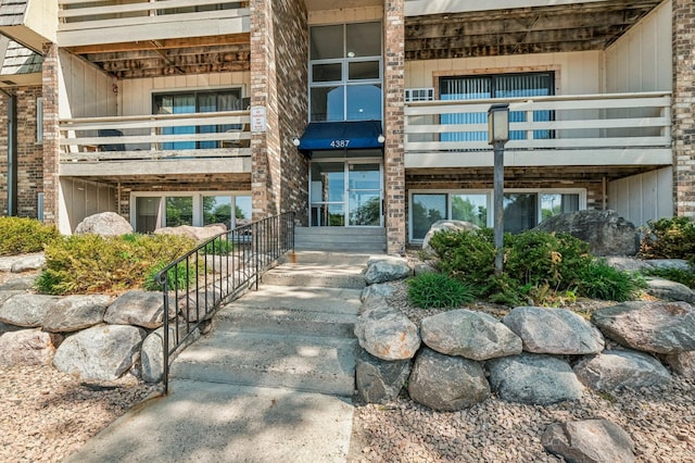 entrance to property with a balcony