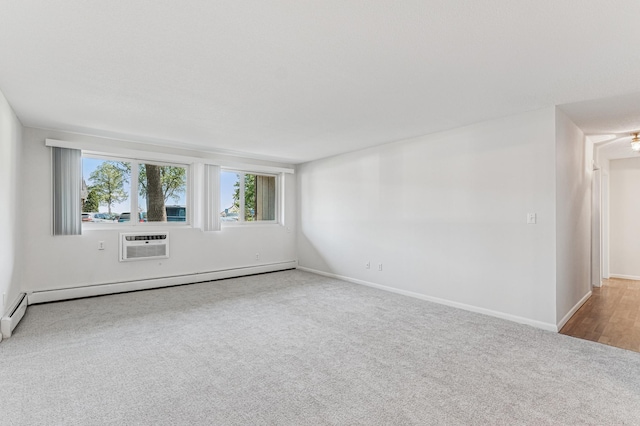 spare room with carpet floors, baseboard heating, baseboards, and a wall mounted AC