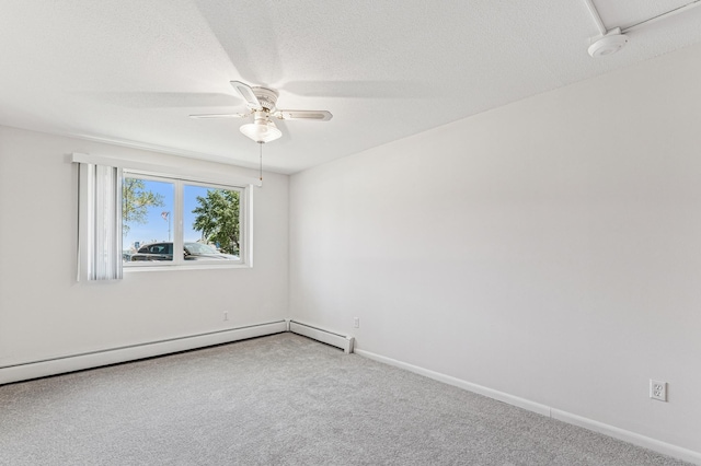 carpeted spare room featuring a ceiling fan, a baseboard heating unit, a textured ceiling, and baseboards
