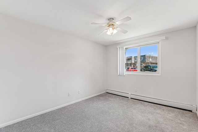 unfurnished room featuring a baseboard heating unit, ceiling fan, carpet flooring, and baseboards