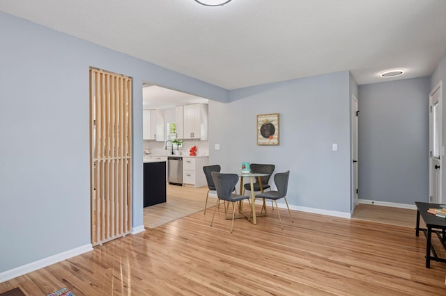 3544 Lee Ave N, Crystal, MN 55422 - dining space with light wood-type flooring and baseboards