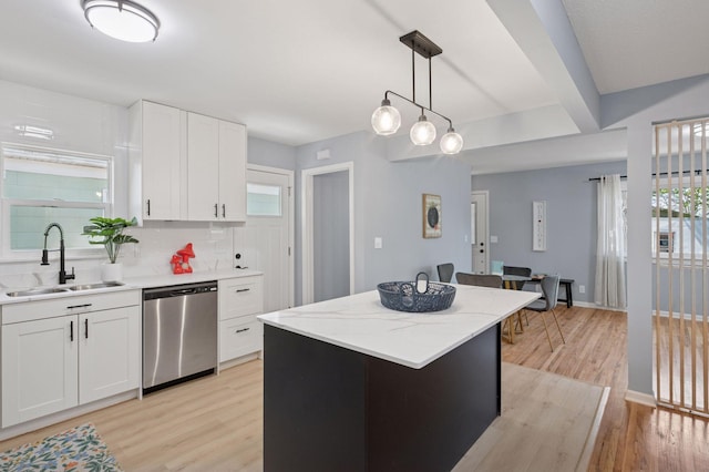 3544 Lee Ave N, Crystal, MN 55422 - kitchen featuring stainless steel dishwasher, a sink, light wood-type flooring, and healthy amount of natural light