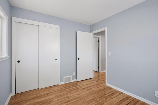 3544 Lee Ave N, Crystal, MN 55422 - unfurnished bedroom featuring light wood-style flooring, baseboards, and a closet