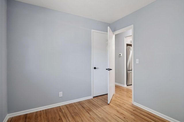 3544 Lee Ave N, Crystal, MN 55422 - unfurnished room with light wood-style floors and baseboards