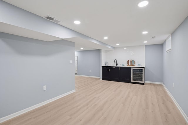 3544 Lee Ave N, Crystal, MN 55422 - indoor wet bar featuring beverage cooler, light wood-type flooring, recessed lighting, and baseboards