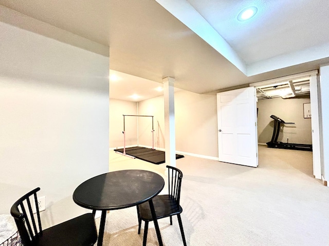 finished basement with recessed lighting, baseboards, and light colored carpet