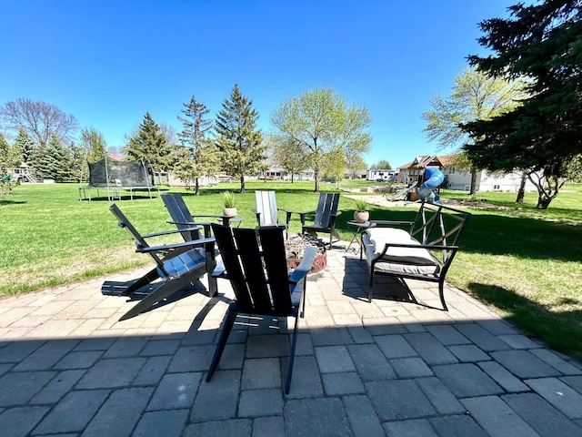 1921 Sherman Dr NW, Alexandria, MN 56308 - view of patio with a trampoline and a playground