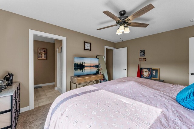 38760 Maple Ct, North Branch, MN 55056 - carpeted bedroom with baseboards, tile patterned flooring, and ceiling fan