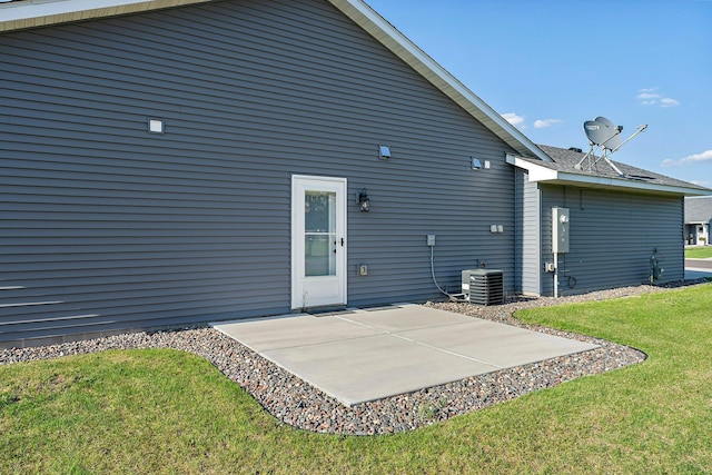38760 Maple Ct, North Branch, MN 55056 - rear view of property with a patio, a lawn, and cooling unit