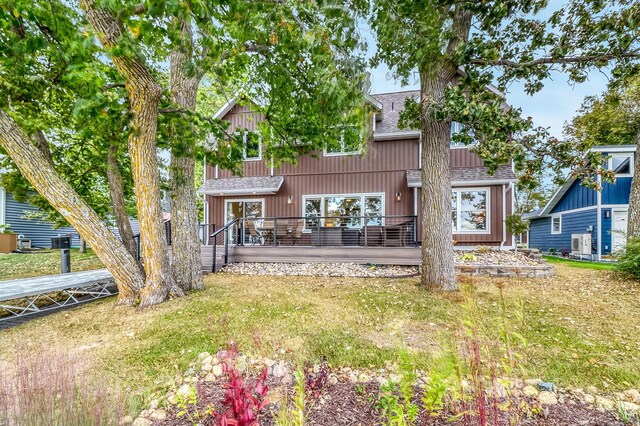 26533 Paradise Point Rd, Detroit Lakes, MN 56501 - rear view of house featuring a shingled roof, a lawn, and central AC