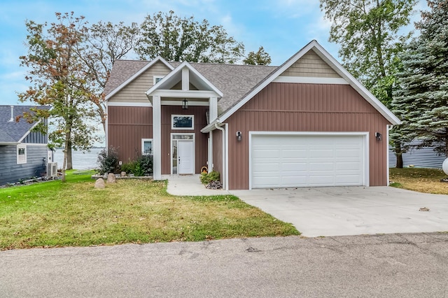 26533 Paradise Point Rd, Detroit Lakes, MN 56501 - view of front of property featuring roof with shingles, concrete driveway, a front lawn, and a garage