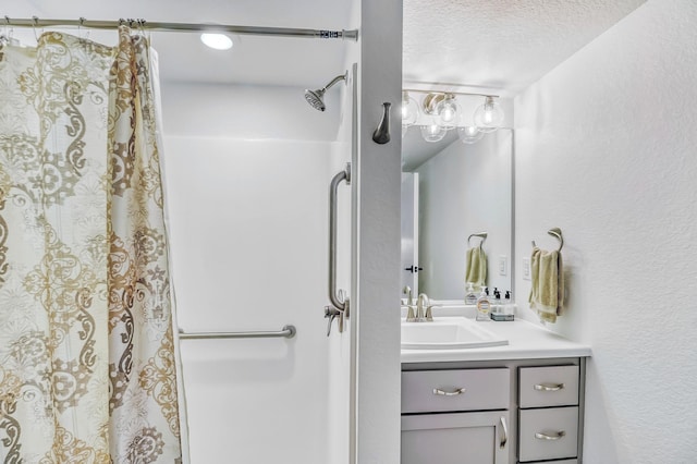 26533 Paradise Point Rd, Detroit Lakes, MN 56501 - bathroom with a textured ceiling, vanity, a shower with shower curtain, and a textured wall