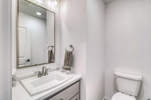 26533 Paradise Point Rd, Detroit Lakes, MN 56501 - half bath with toilet, vanity, and a textured wall