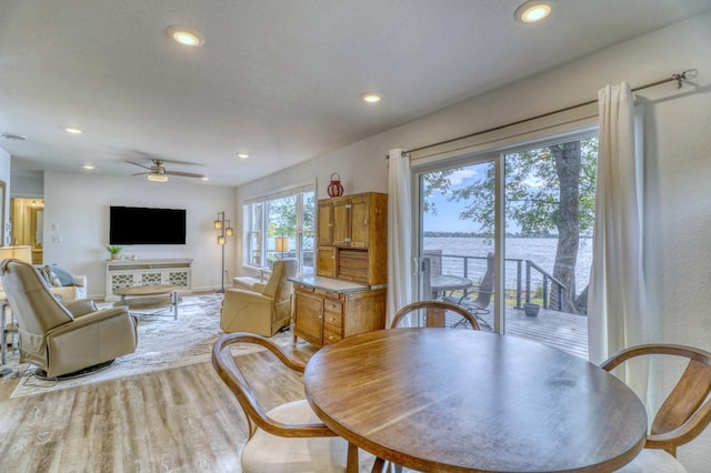 26533 Paradise Point Rd, Detroit Lakes, MN 56501 - dining room featuring recessed lighting, light wood-style floors, a ceiling fan, and a water view