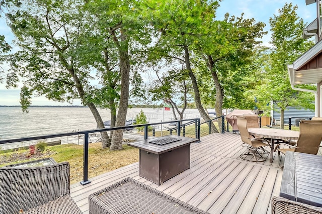 26533 Paradise Point Rd, Detroit Lakes, MN 56501 - wooden terrace featuring a water view, outdoor dining space, and a fire pit