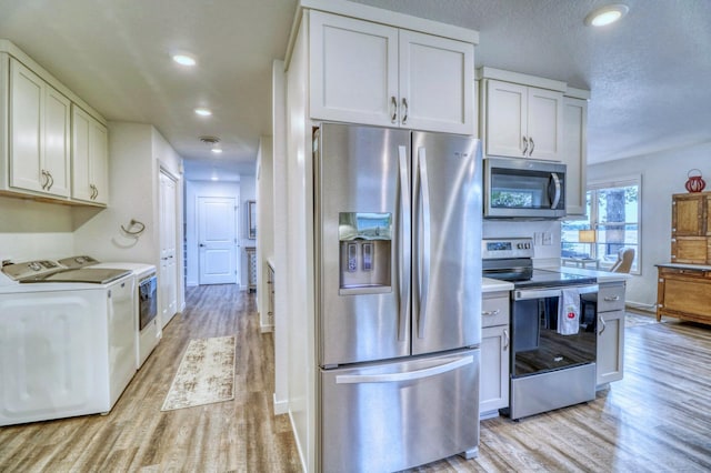 26533 Paradise Point Rd, Detroit Lakes, MN 56501 - kitchen featuring appliances with stainless steel finishes, separate washer and dryer, light wood finished floors, light countertops, and recessed lighting