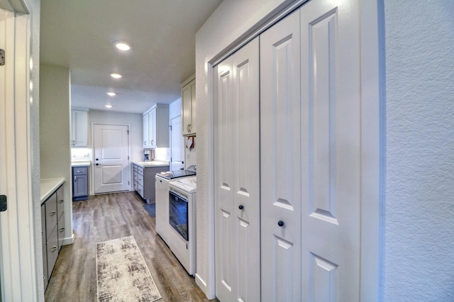 26533 Paradise Point Rd, Detroit Lakes, MN 56501 - kitchen featuring dark wood-type flooring, light countertops, a textured wall, range, and recessed lighting