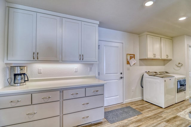 26533 Paradise Point Rd, Detroit Lakes, MN 56501 - laundry area with separate washer and dryer, light wood finished floors, baseboards, recessed lighting, and cabinet space