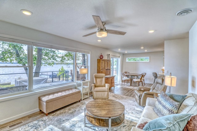 26533 Paradise Point Rd, Detroit Lakes, MN 56501 - living area featuring healthy amount of natural light, baseboards, wood finished floors, and recessed lighting