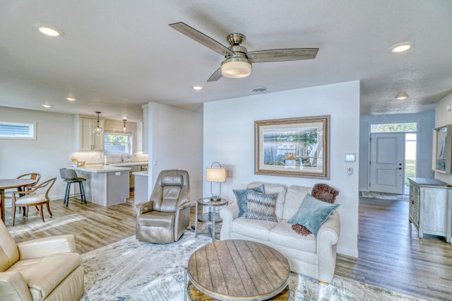 26533 Paradise Point Rd, Detroit Lakes, MN 56501 - living room featuring light wood finished floors, baseboards, recessed lighting, and a ceiling fan