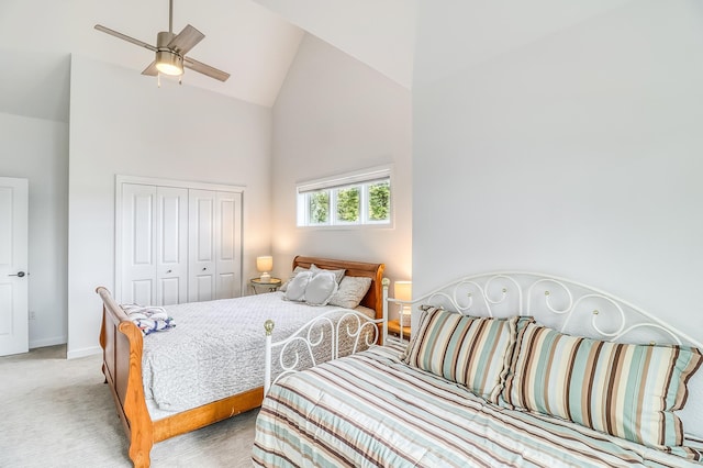26533 Paradise Point Rd, Detroit Lakes, MN 56501 - bedroom with high vaulted ceiling, light carpet, a closet, baseboards, and a ceiling fan