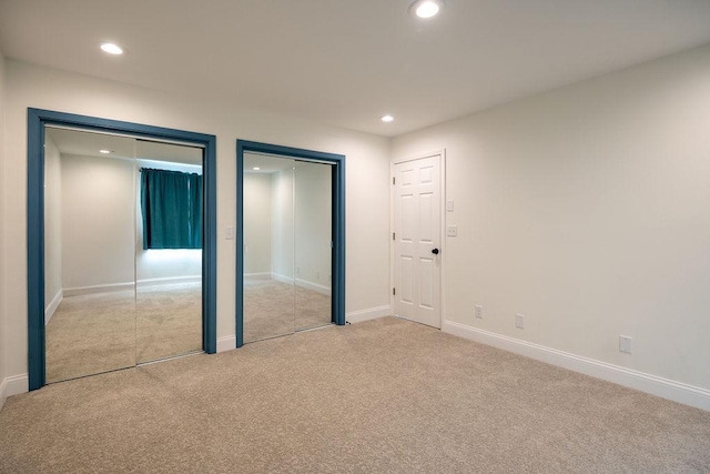408 19th St NW, Willmar, MN 56201 - unfurnished bedroom featuring multiple closets, carpet floors, recessed lighting, and baseboards