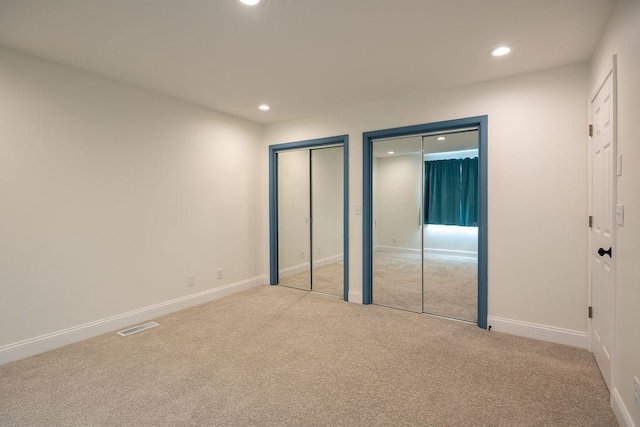 408 19th St NW, Willmar, MN 56201 - unfurnished bedroom featuring recessed lighting, carpet flooring, two closets, and baseboards