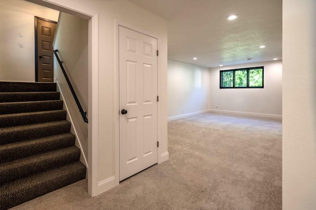 408 19th St NW, Willmar, MN 56201 - below grade area with carpet, recessed lighting, stairs, and baseboards