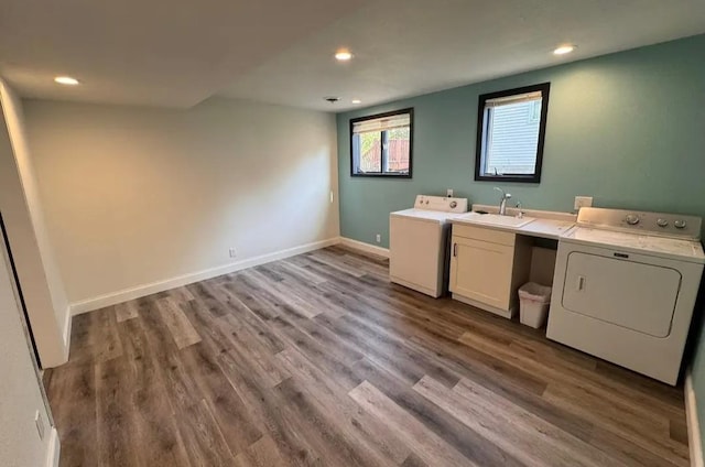 408 19th St NW, Willmar, MN 56201 - clothes washing area featuring cabinet space, independent washer and dryer, recessed lighting, wood finished floors, and baseboards
