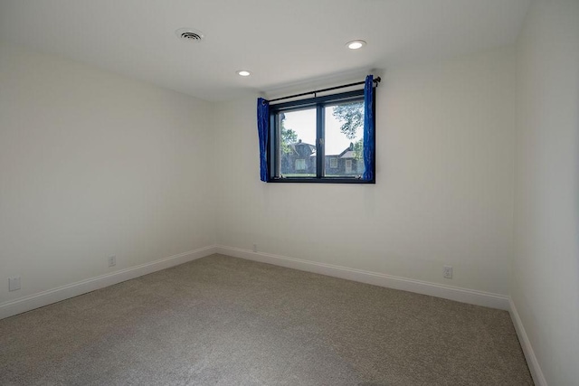 408 19th St NW, Willmar, MN 56201 - empty room featuring light colored carpet, baseboards, and recessed lighting