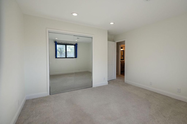 408 19th St NW, Willmar, MN 56201 - unfurnished bedroom with light carpet, a closet, recessed lighting, and baseboards