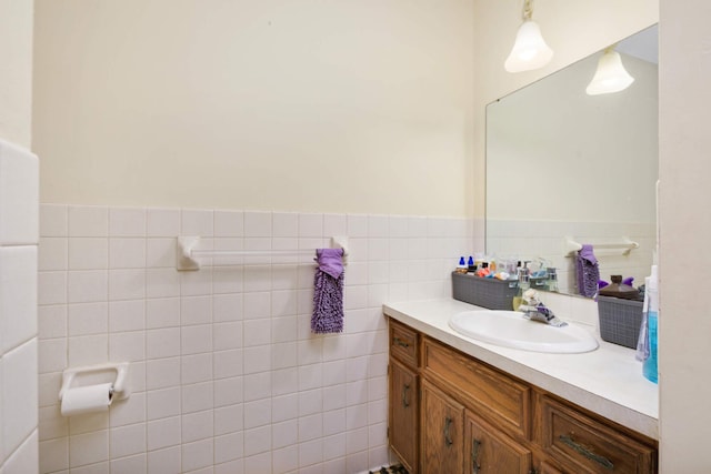 11110 Utica Ave S, Bloomington, MN 55437 - bathroom featuring vanity, tile walls, and a wainscoted wall