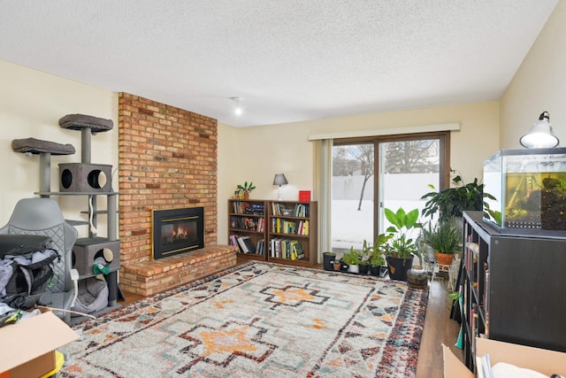 11110 Utica Ave S, Bloomington, MN 55437 - living room with a textured ceiling, a brick fireplace, and wood finished floors