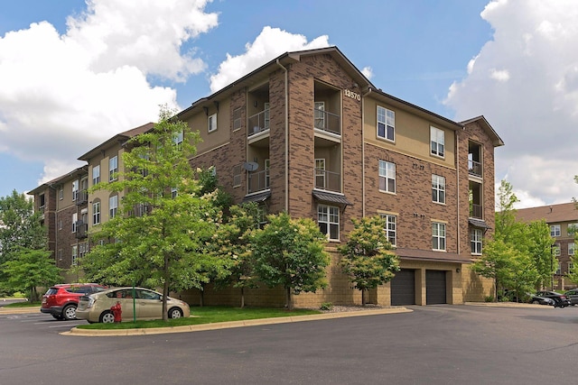 13560 Technology Dr Unit 1325, Eden Prairie, MN 55344 - view of apartment building / complex with an attached garage