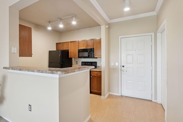 13560 Technology Dr Unit 1325, Eden Prairie, MN 55344 - kitchen with black appliances, rail lighting, brown cabinetry, a peninsula, and ornamental molding