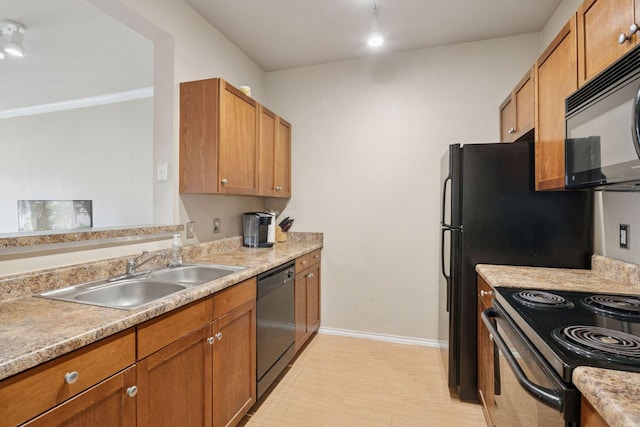 13560 Technology Dr Unit 1325, Eden Prairie, MN 55344 - kitchen featuring black appliances, a sink, light countertops, light wood-style flooring, and brown cabinets