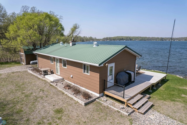 38603 Cozy Cove Rd, Dead Lake Twp, MN 56528 - back of house featuring a deck with water view and metal roof
