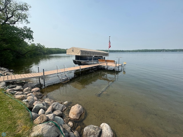 38603 Cozy Cove Rd, Dead Lake Twp, MN 56528 - dock with boat lift and a water view