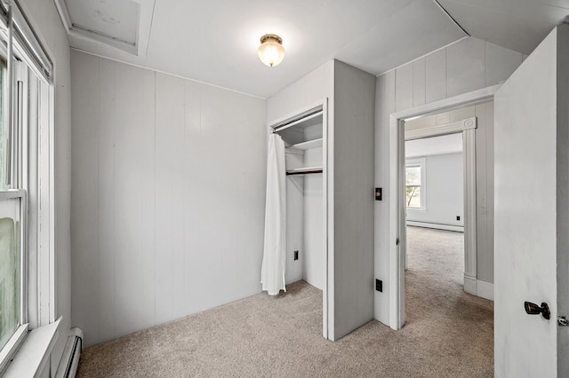 444 Vincent St, Saint Croix Falls, WI 54024 - unfurnished bedroom featuring a baseboard radiator, carpet floors, and a closet