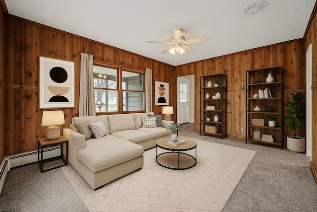 444 Vincent St, Saint Croix Falls, WI 54024 - living room featuring wood walls, light carpet, and ceiling fan